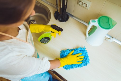 Local cleaner maintaining a communal area in Croydon