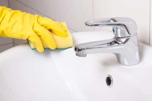 Housekeeper tidying a Croydon living room with care